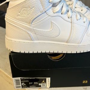 Triple white Nike dunks